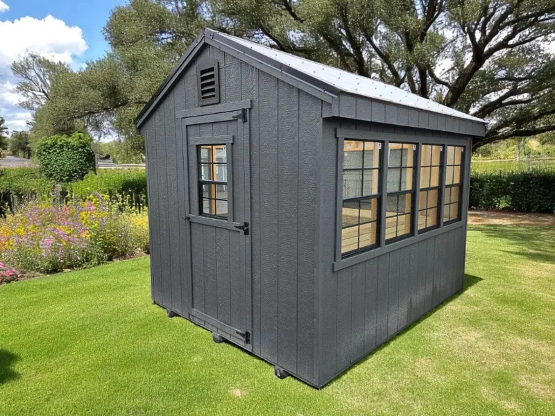 Side view of greenhouse showing door and window placement