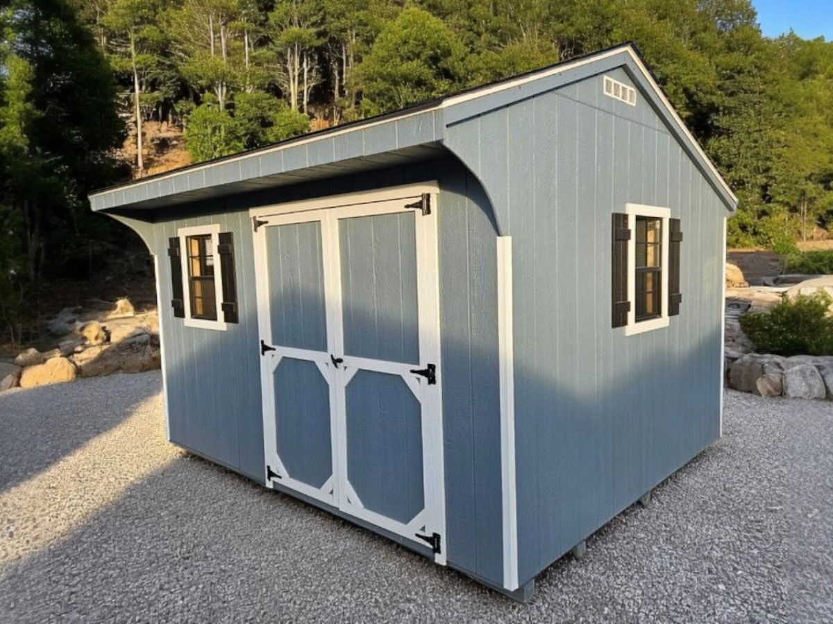 10X12 Quaker with blue siding and black roof