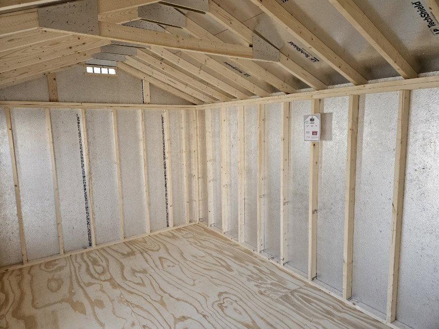 Workshop shed interior with tall sidewalls and bright natural light